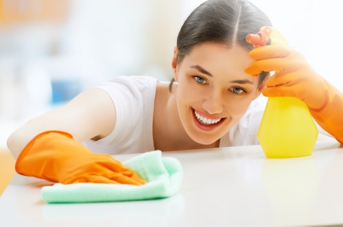Team member wearing PPE while carrying out professional carpet cleaning